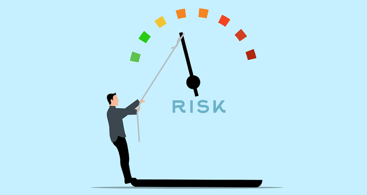 An illustration of a man pulling a risk meter to the green side.